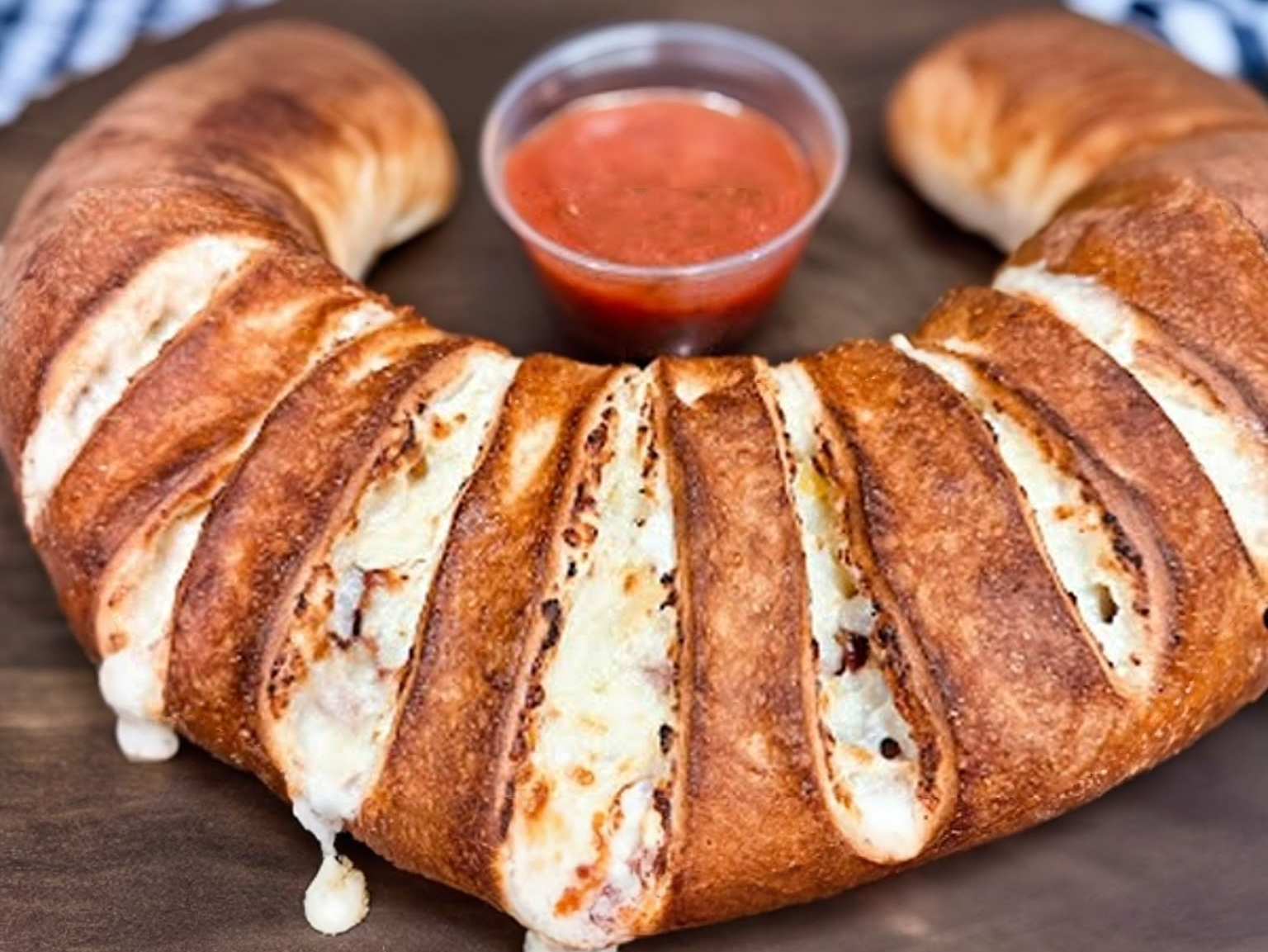 Golden-baked calzone with marinara dipping sauce