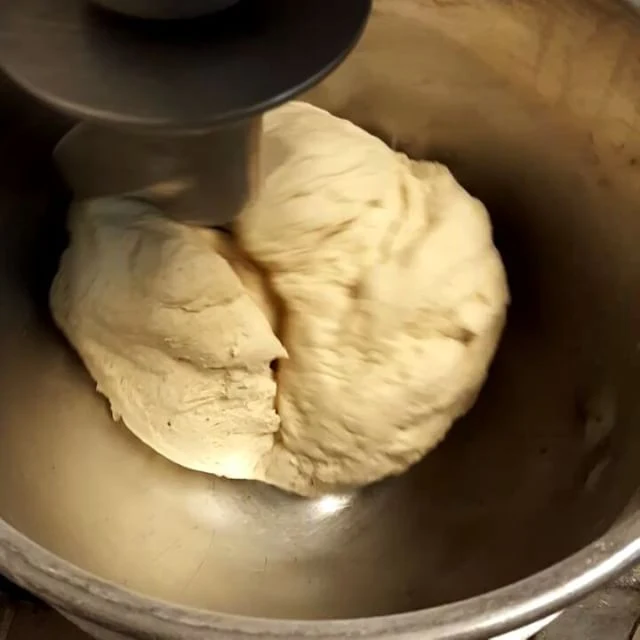Fresh pizza dough being mixed
