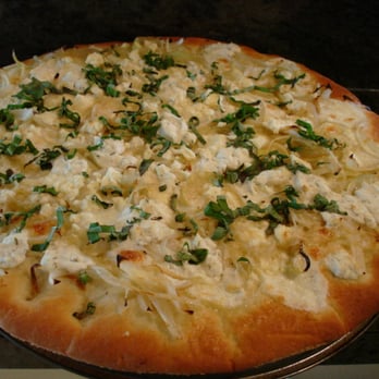 White clam pizza topped with fresh parsley