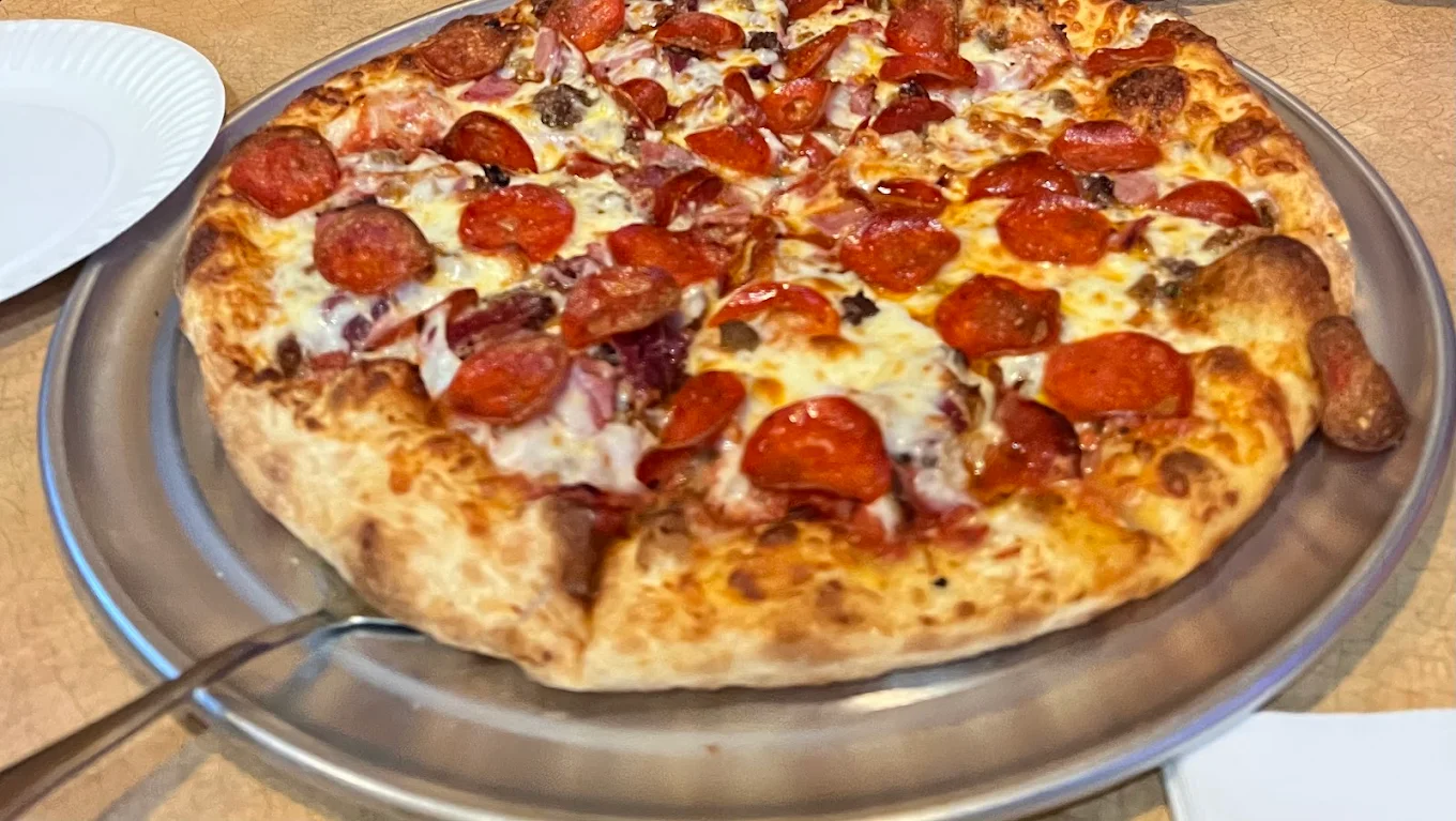 Pepperoni pizza on a metal pan