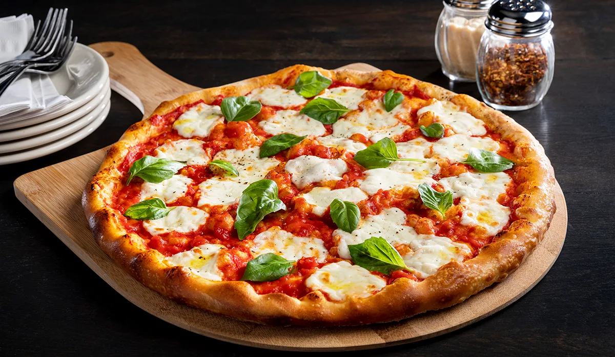 Margherita pizza on a wooden board